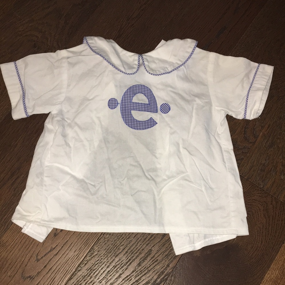 White Shirt with Blue Letter Design